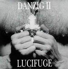 The second danzig album cover art, featuring a black and white photo of Danzig's hairy white chest, his hands gripping a crucifix with a demon skull on it.