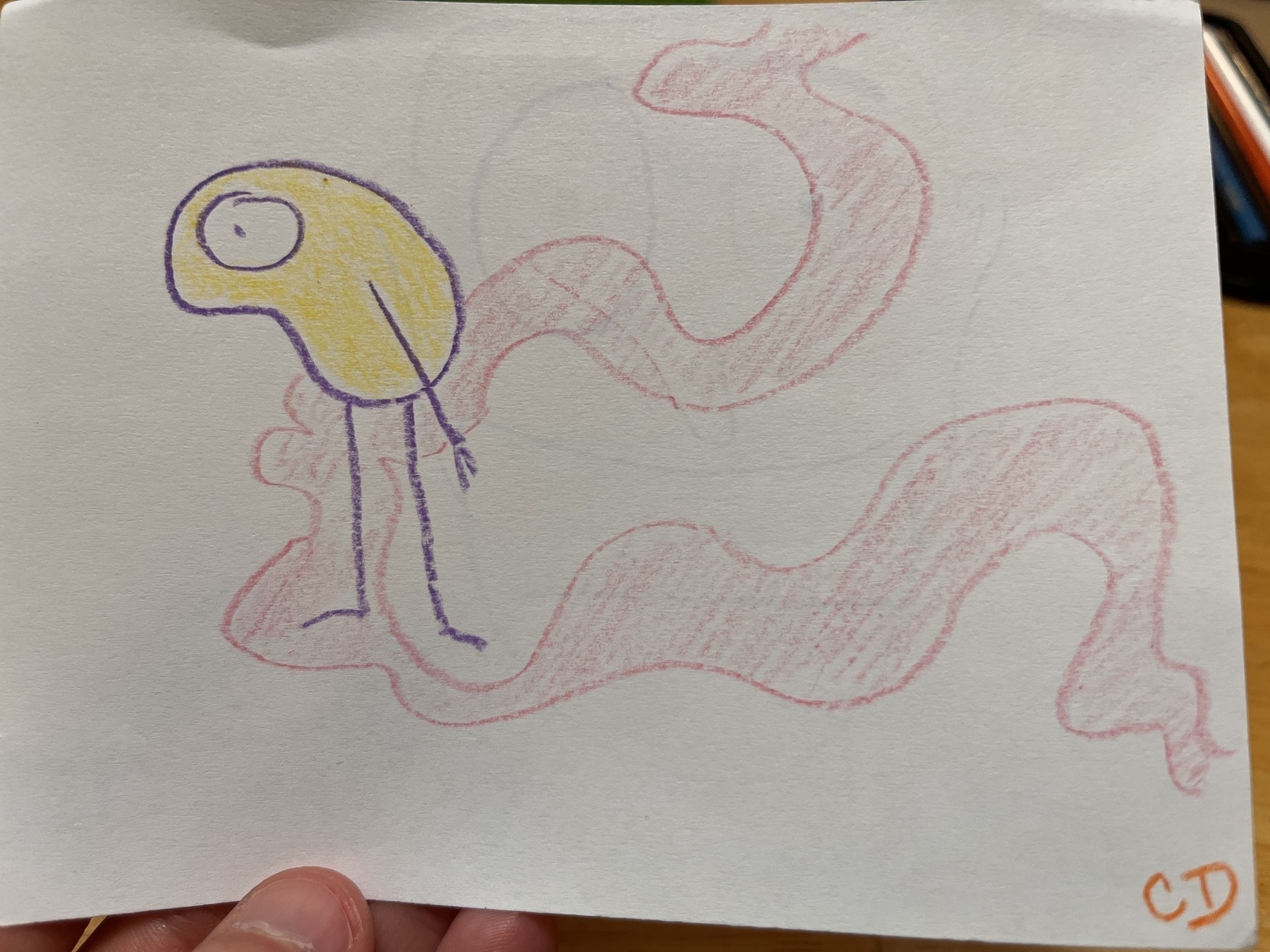 A purple lined bean shape with a big eye and stick arms and legs. It stares off the page. There’s a pink swirl around it. 