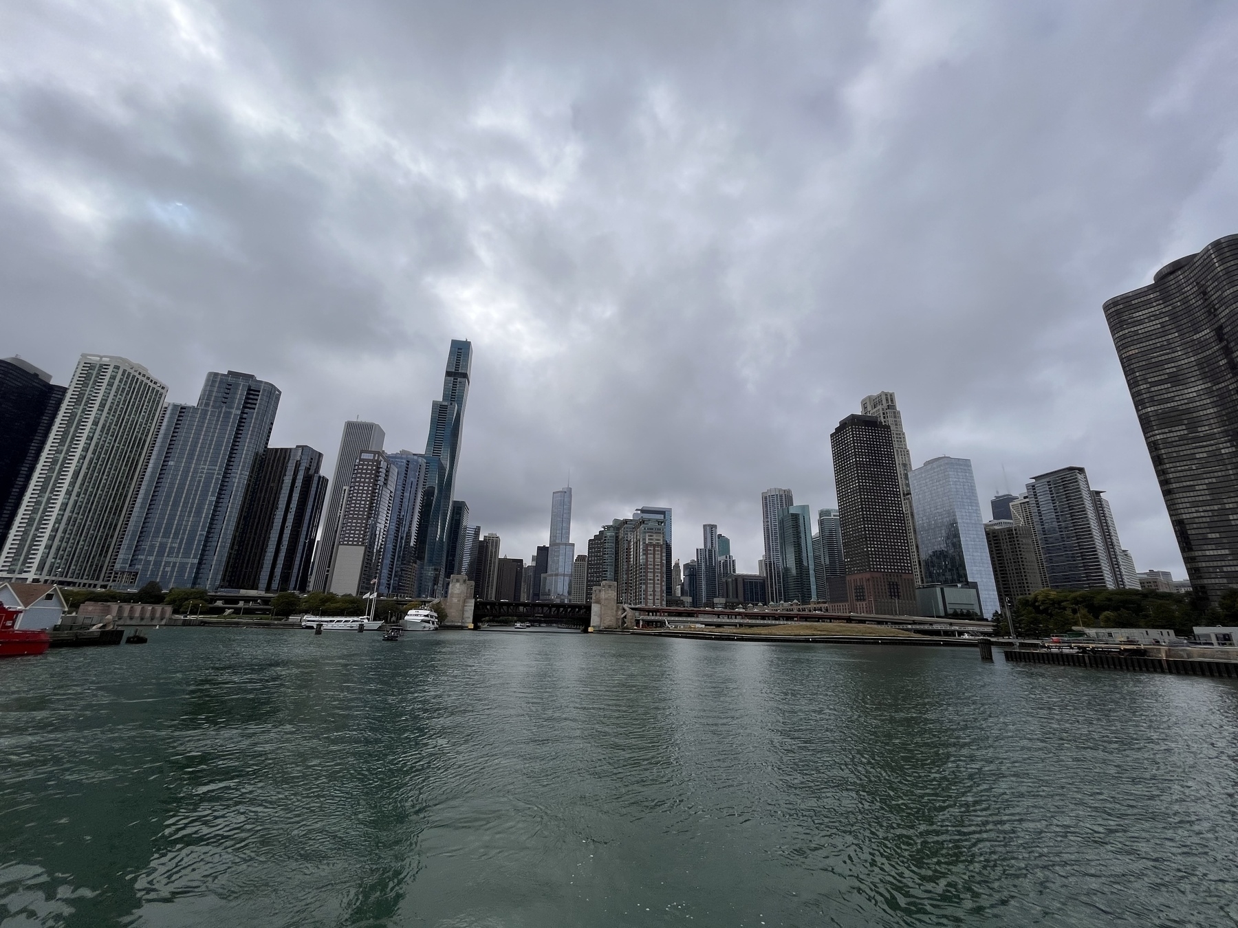The Chicago skyline taken from the water. Stormy skies loom overhead. 