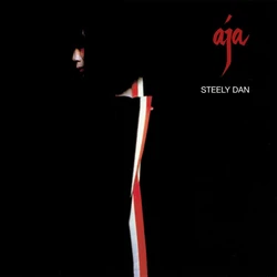 aja album cover. a black field, with the title in red in the upper left. a sliver of a traditional geisha's face and gown slice through the darkness.
