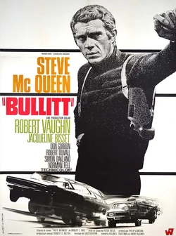 Bullitt poster. Steve McQueen, a rugged white man, looking determined, leaning against an unseen wall. He is wearing a turtle neck and a gun holster. Superimposed in front are two sleek cars in a high speed chase. Both McQueen and the chase are rendered in pointalism black and white.