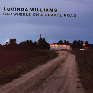 Album cover of Car Wheels on a Gravel Road. Photgraph of a dirt country road at twilight, leading to a warmly lit little house.