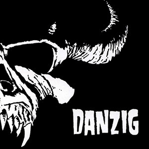 The first danzig album cover art, featuring a black field with a demon skull emossed in white