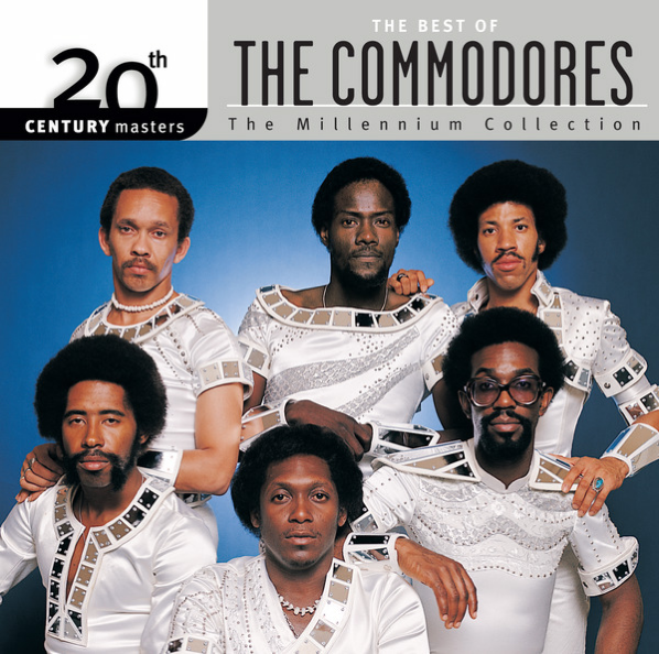 Auto-generated description: A group of six black men in matching white outfits is featured on the cover of The Best of The Commodores from the Millennium Collection. The afro future vibes are very strong.